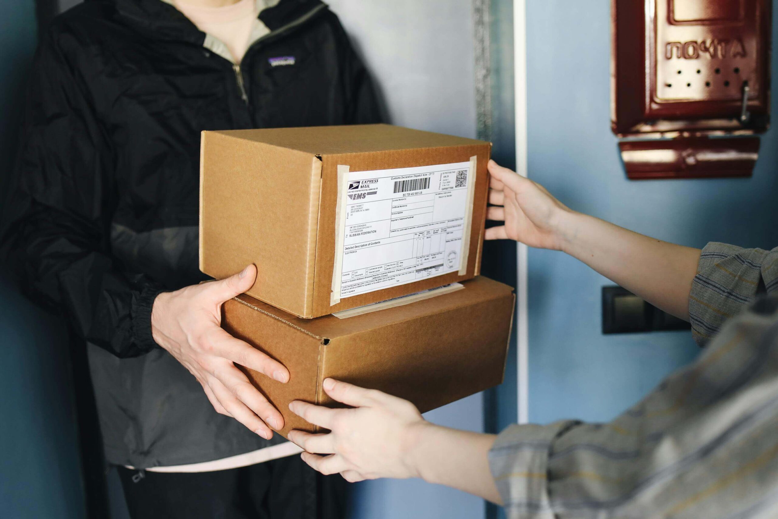 Shopper receiving package from a delivery man