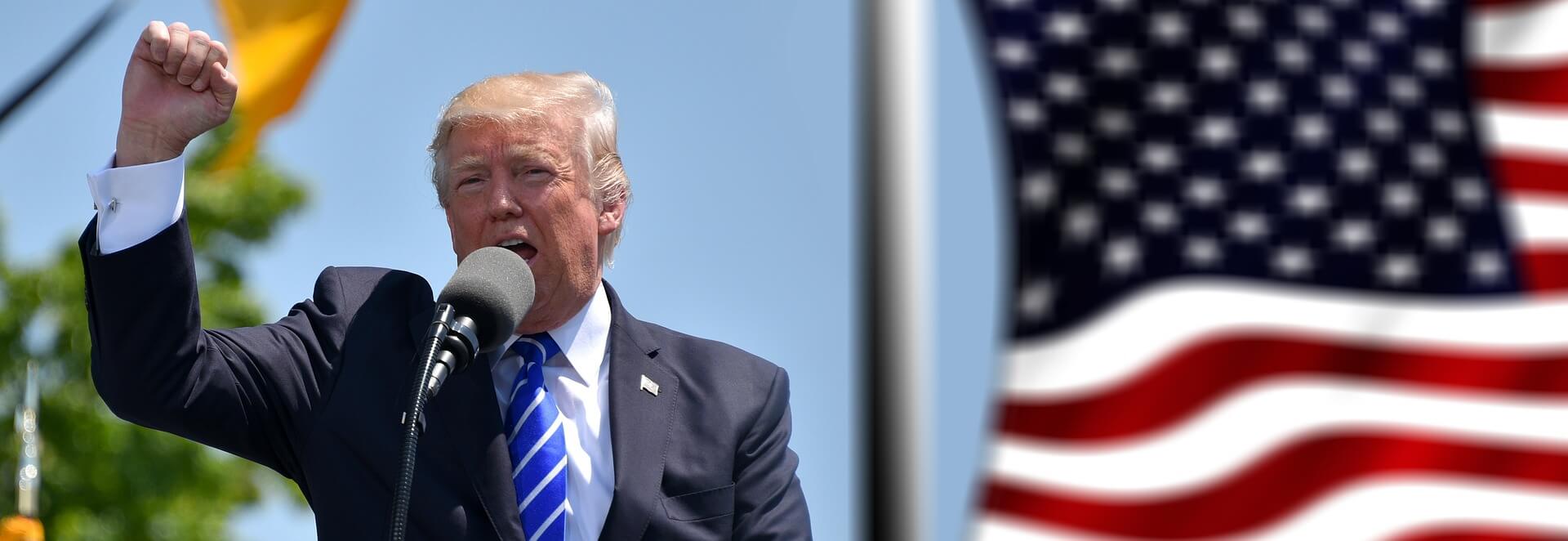 President Donald Trump with the US flag in the background