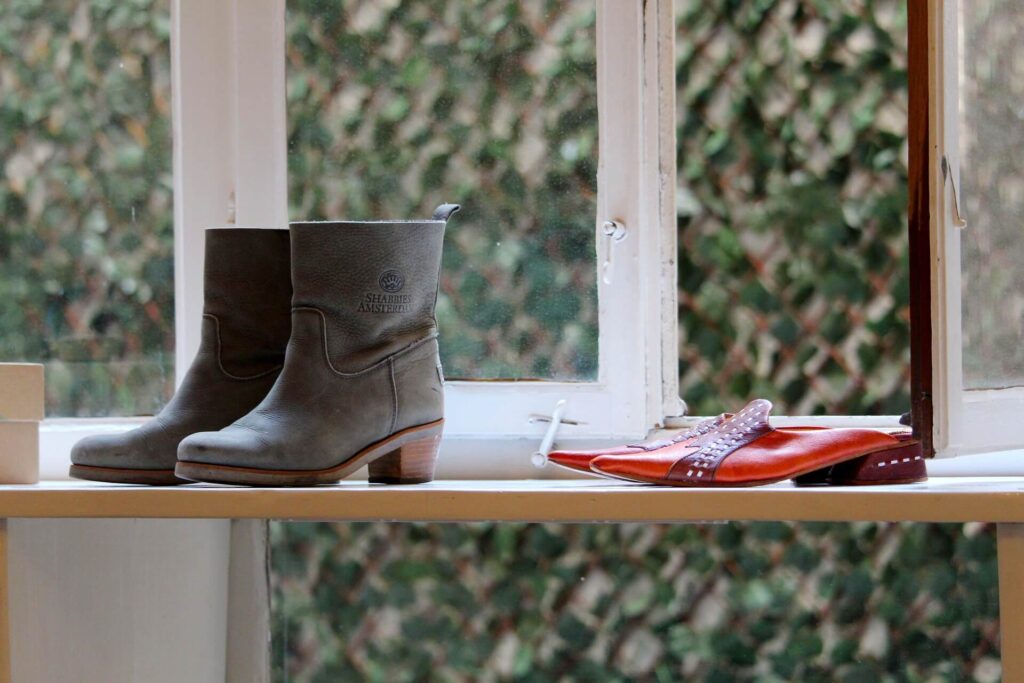 boots and shoes on a shelf