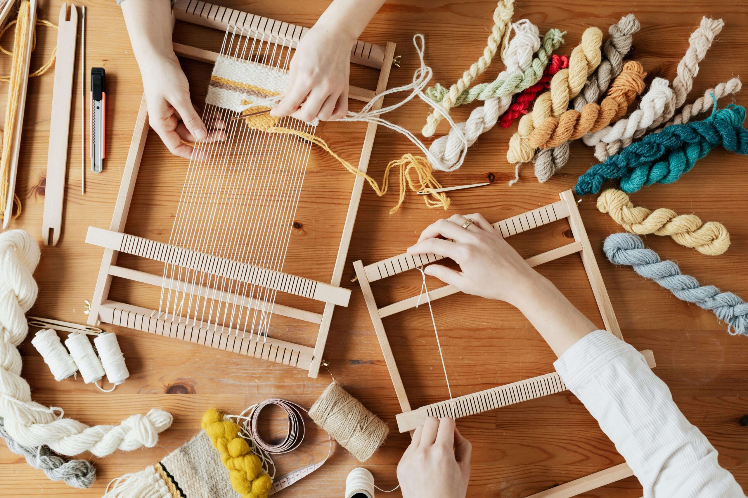 two artisans creating handmade yarn products to sell online