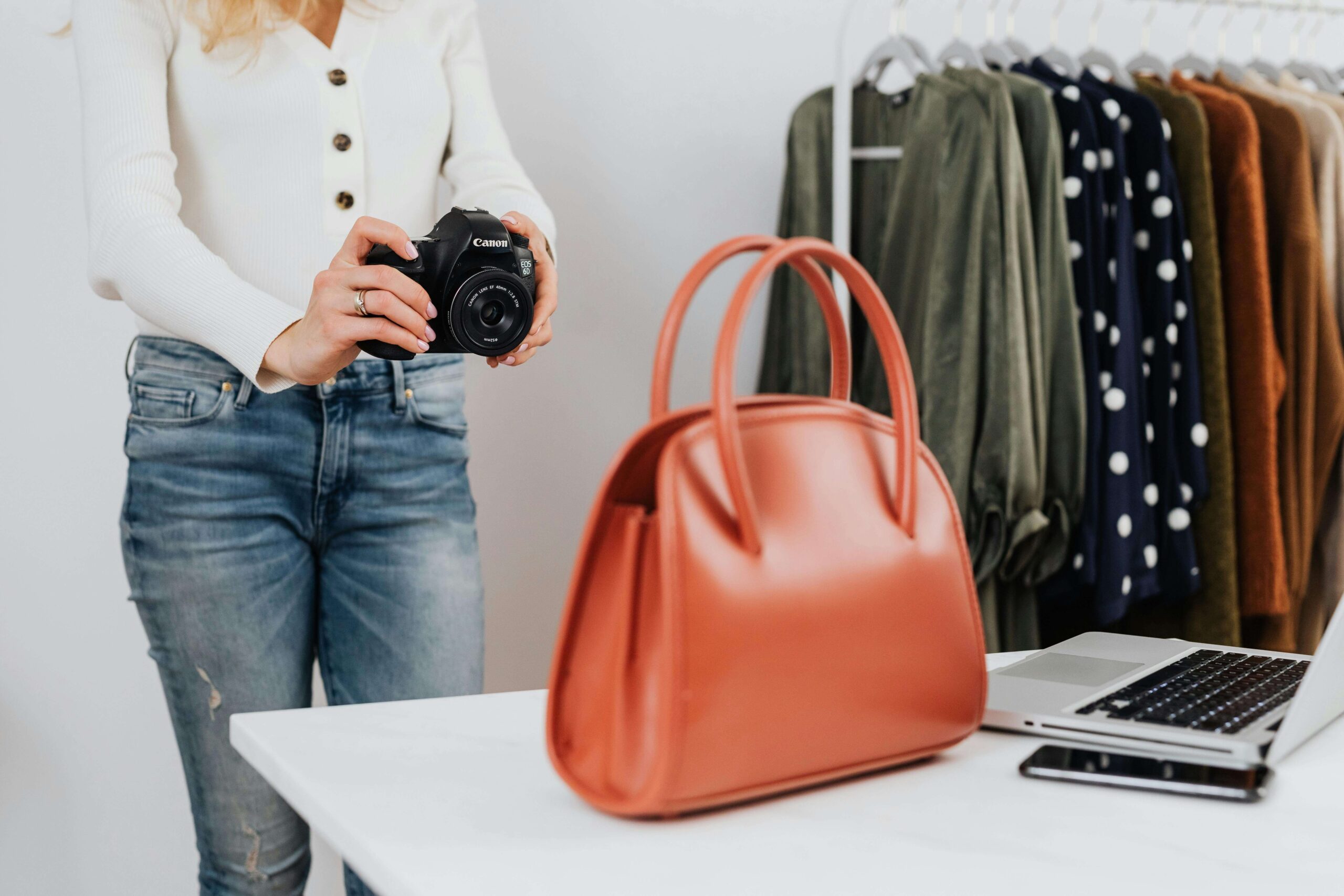 online seller taking a photo of a bag she's selling on Amazon