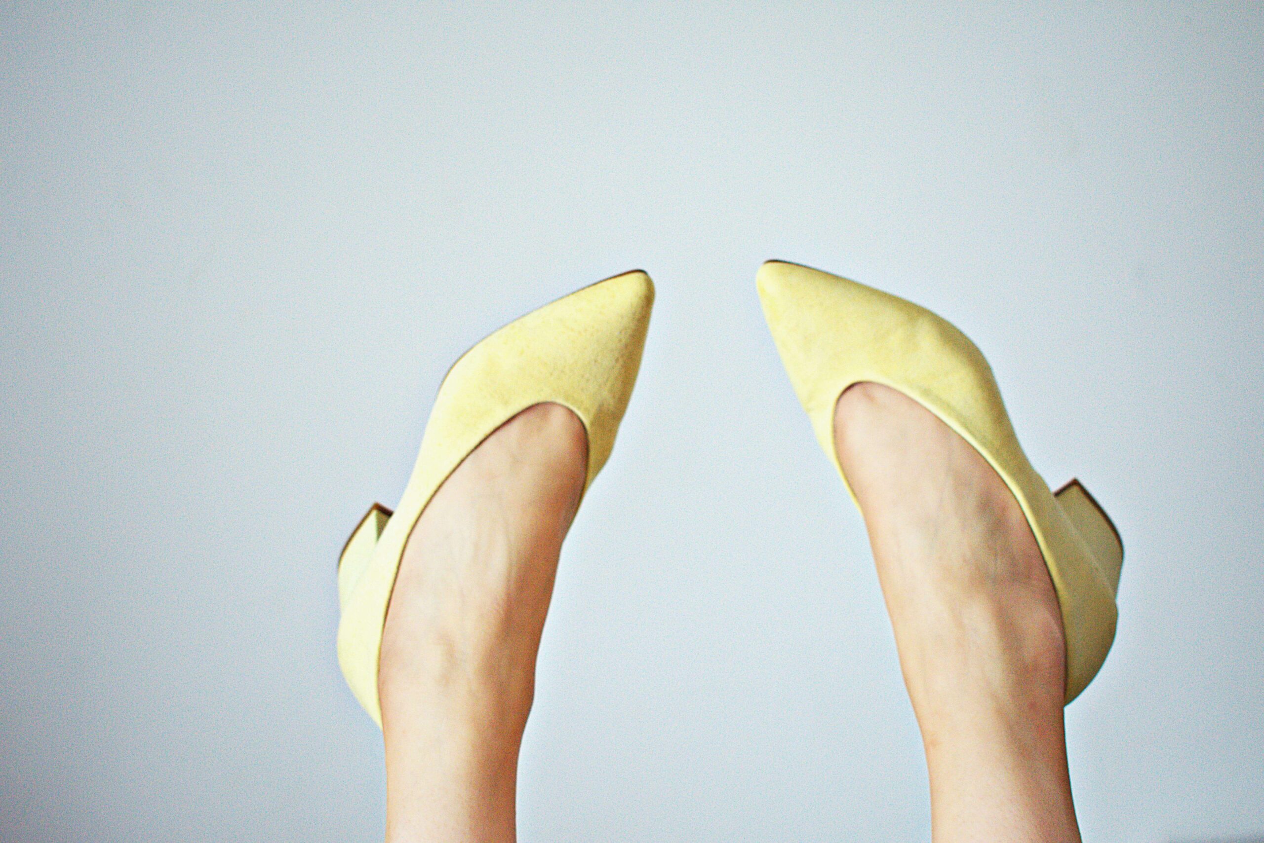 feet in yellow shoes
