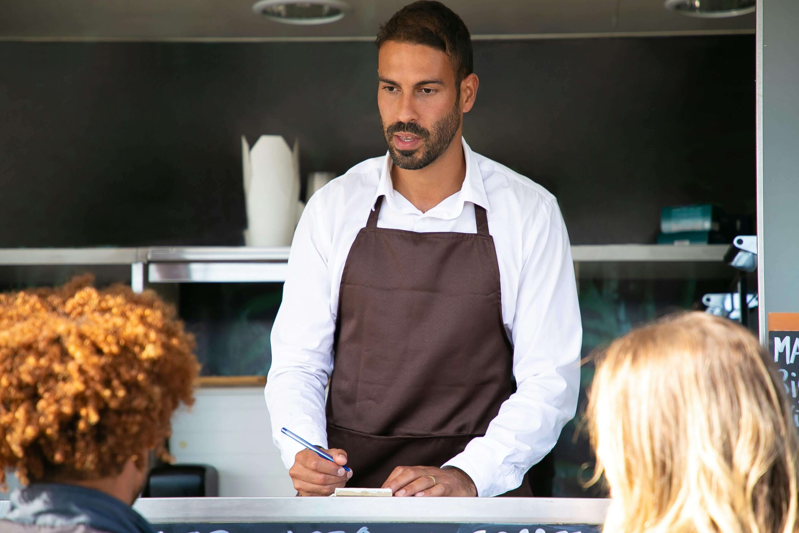 business owner talking to his customers
