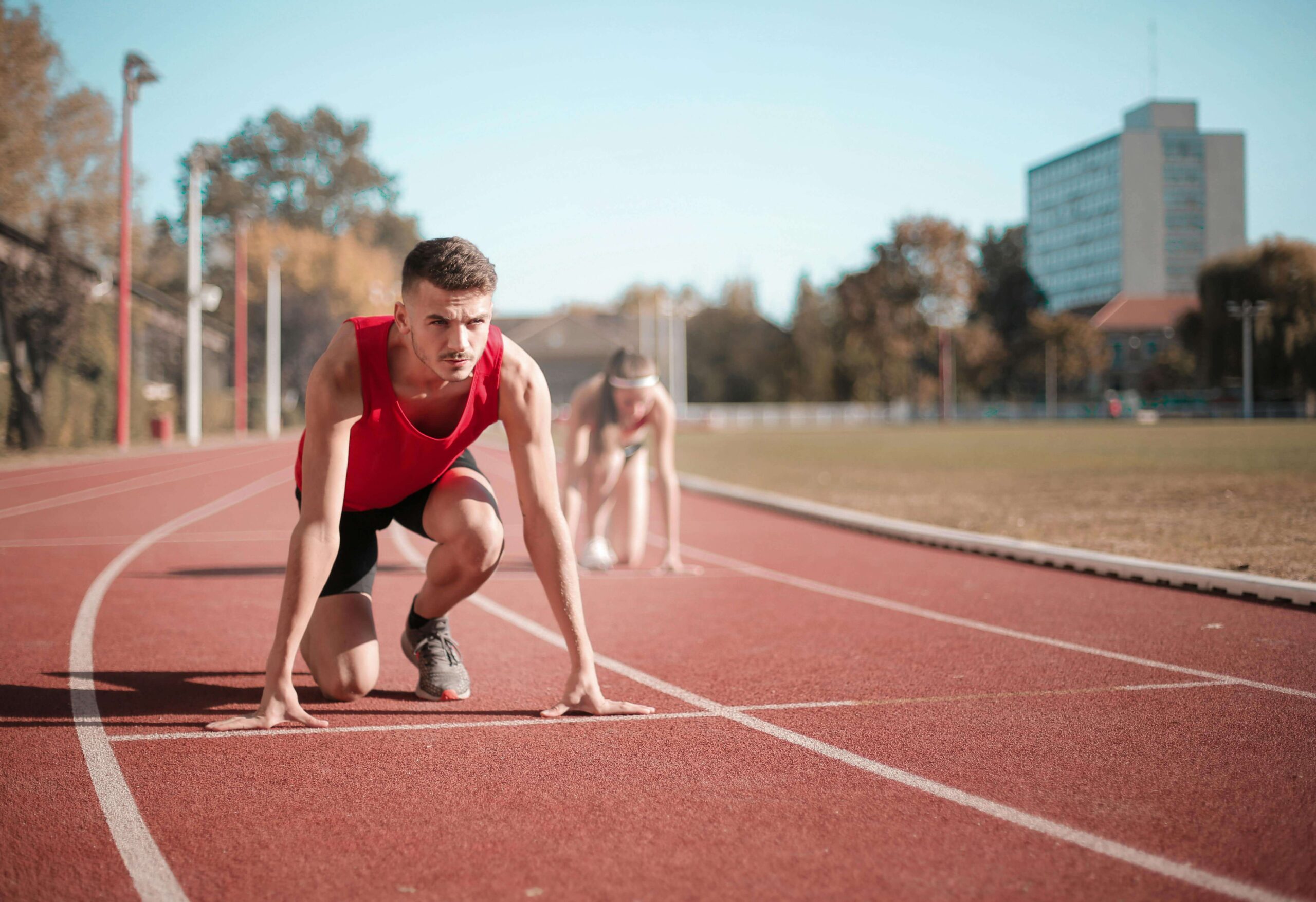 race track runner getting ready to run