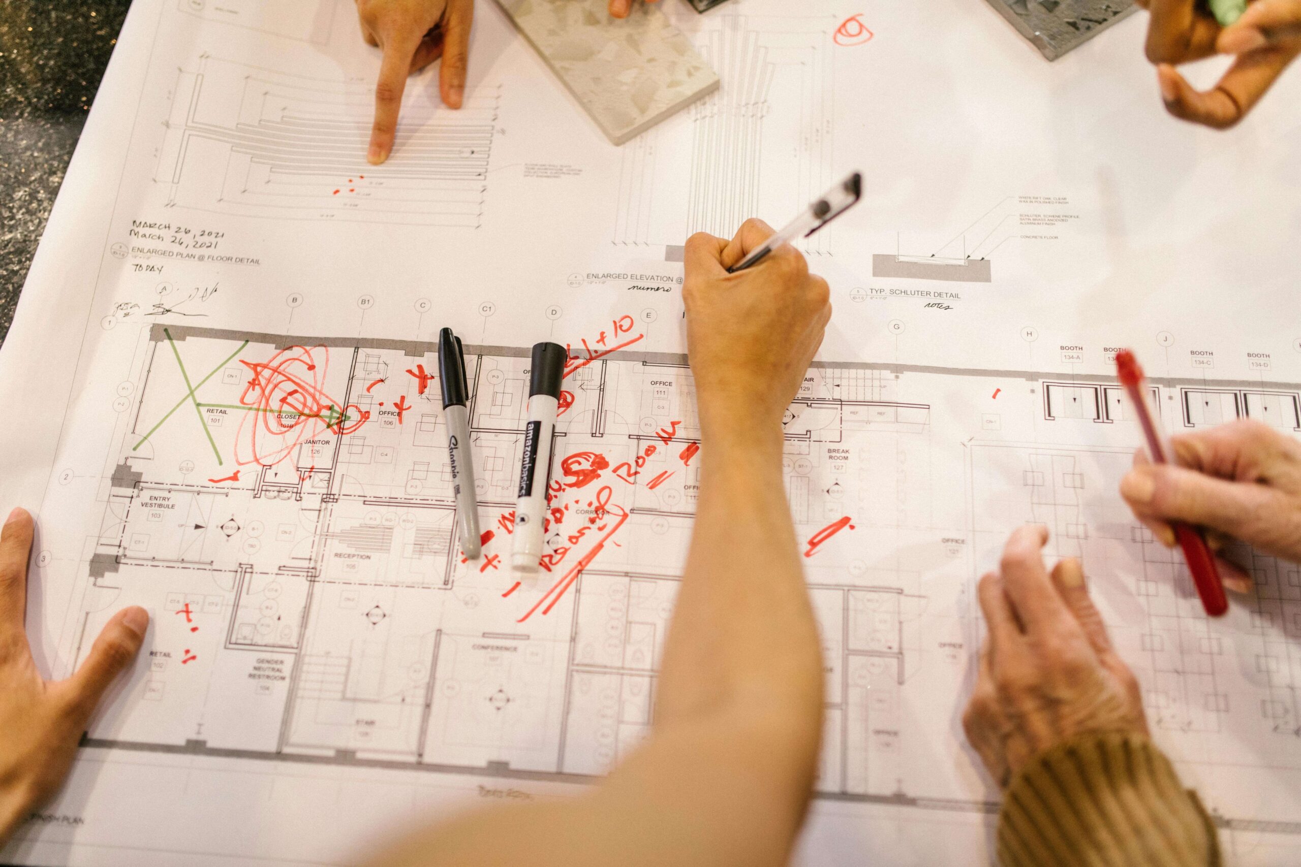 architect fixing an architectural plan