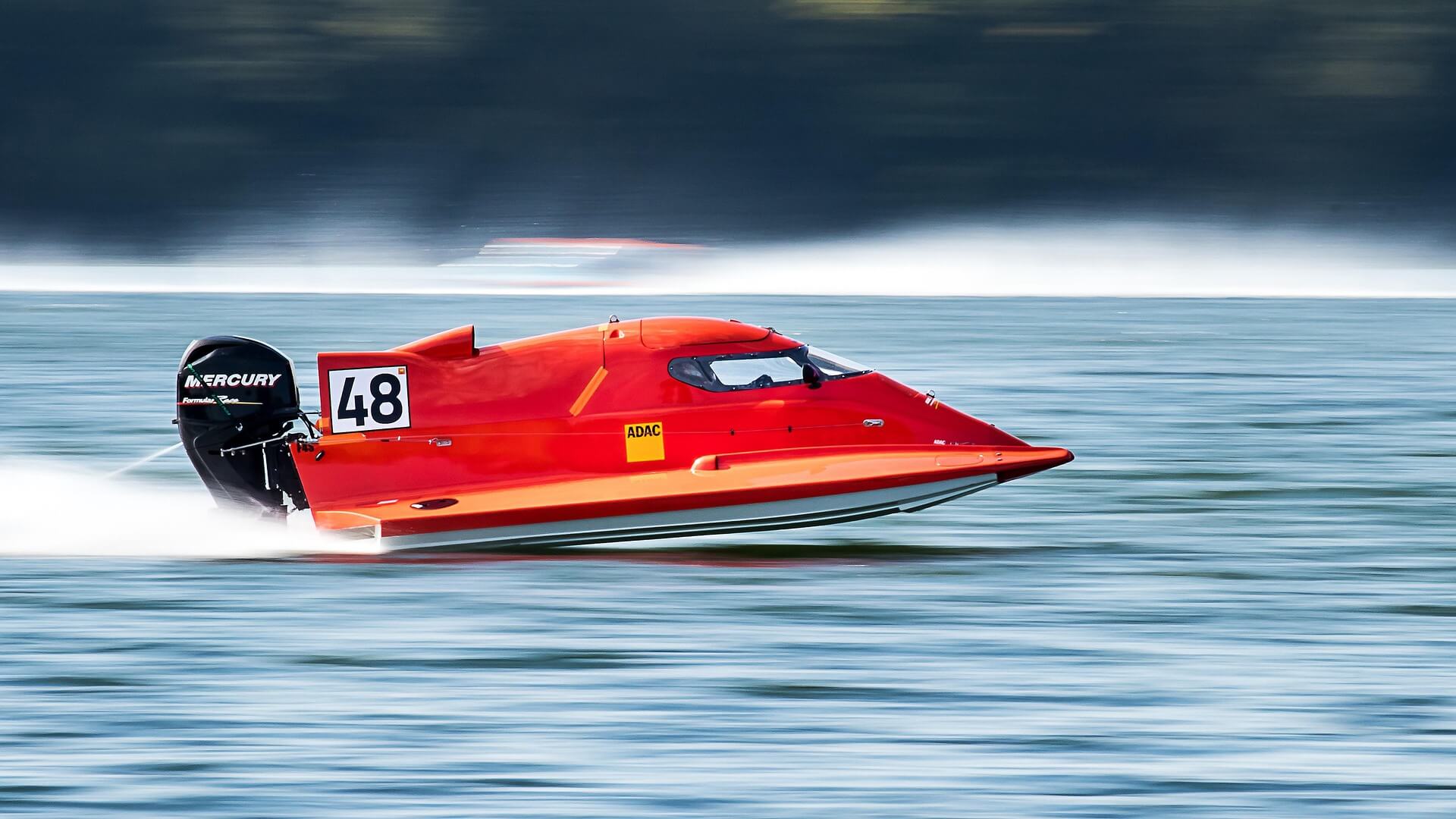 speed boat speeding on the water
