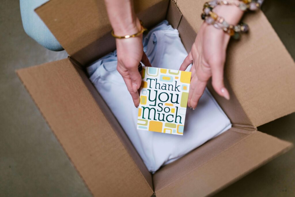 Thank you note from an online seller being placed in a box