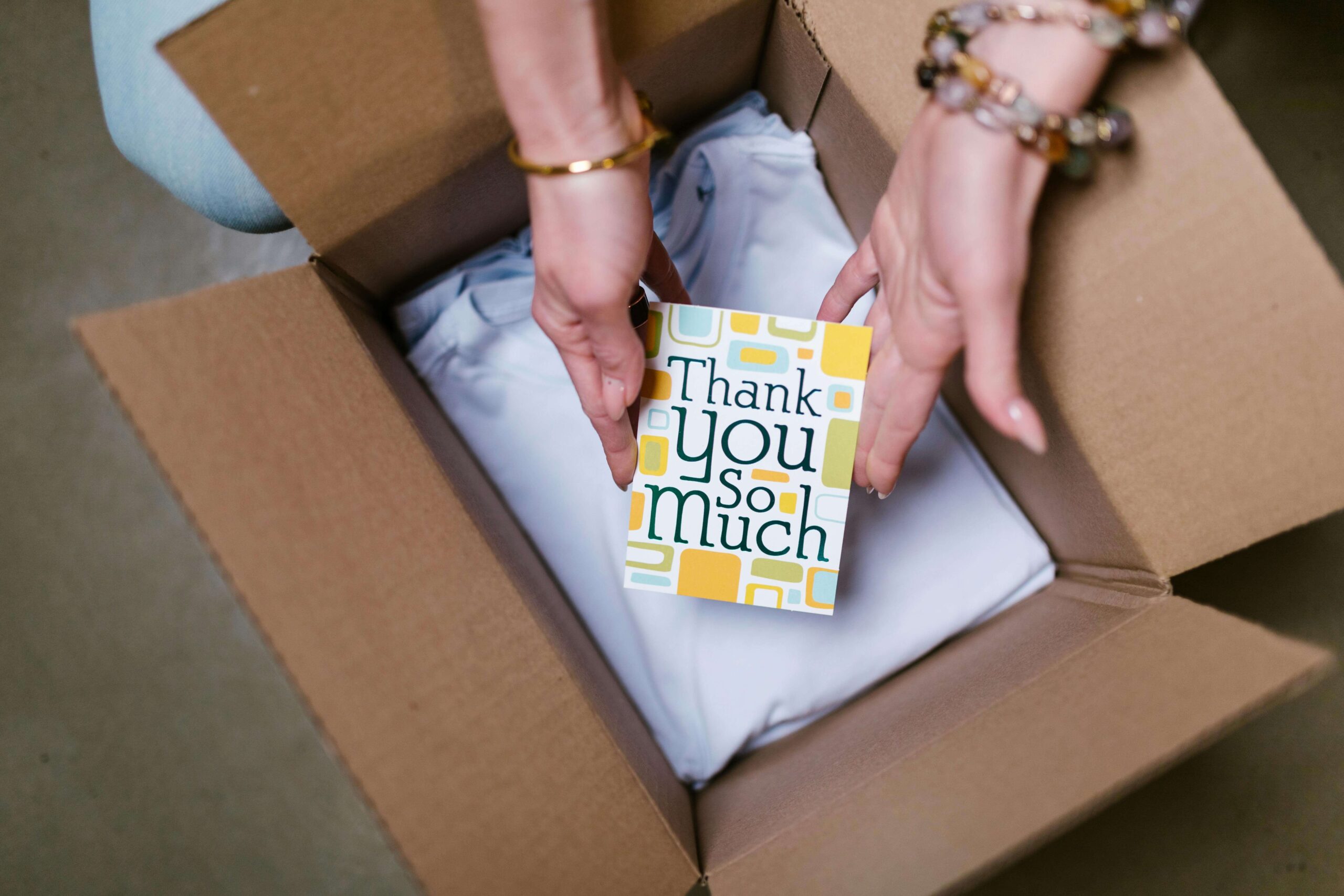 Thank you note from an online seller being placed in a box