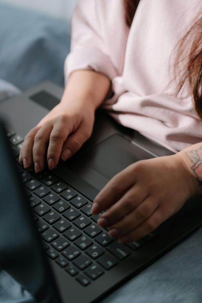 woman working online through her laptop